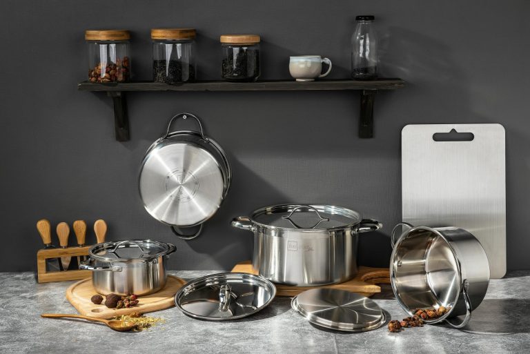 Stainless steel cookware set neatly arranged on a kitchen counter — non-toxic and durable option for healthy cooking.